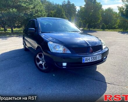 Чорний Міцубісі Lancer, об'ємом двигуна 1.6 л та пробігом 244 тис. км за 4100 $, фото 1 на Automoto.ua