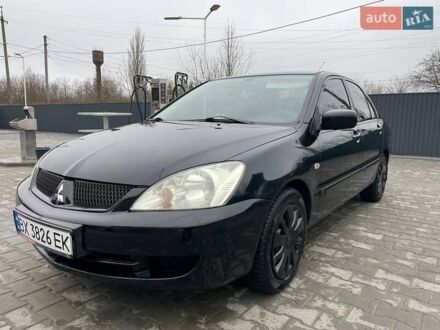 Чорний Міцубісі Lancer, об'ємом двигуна 1.58 л та пробігом 282 тис. км за 4100 $, фото 1 на Automoto.ua