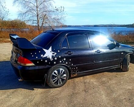 Черный Мицубиси Лансер, объемом двигателя 1.6 л и пробегом 25500 тыс. км за 3700 $, фото 1 на Automoto.ua