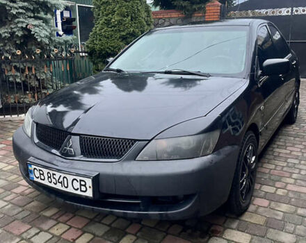 Чорний Міцубісі Lancer, об'ємом двигуна 1.59 л та пробігом 305 тис. км за 2950 $, фото 1 на Automoto.ua