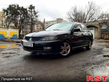 Чорний Міцубісі Lancer, об'ємом двигуна 2 л та пробігом 270 тис. км за 4900 $, фото 1 на Automoto.ua