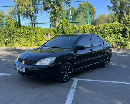 Чорний Міцубісі Lancer, об'ємом двигуна 1.58 л та пробігом 205 тис. км за 4700 $, фото 1 на Automoto.ua