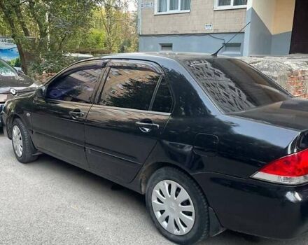 Чорний Міцубісі Lancer, об'ємом двигуна 1.58 л та пробігом 393 тис. км за 3600 $, фото 1 на Automoto.ua