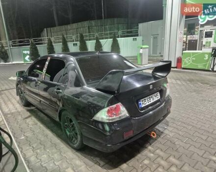 Черный Мицубиси Лансер, объемом двигателя 2 л и пробегом 289 тыс. км за 4000 $, фото 1 на Automoto.ua