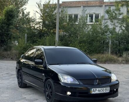 Чорний Міцубісі Lancer, об'ємом двигуна 2 л та пробігом 170 тис. км за 5500 $, фото 1 на Automoto.ua