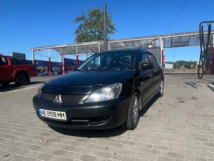 Чорний Міцубісі Lancer, об'ємом двигуна 2 л та пробігом 181 тис. км за 6000 $, фото 1 на Automoto.ua
