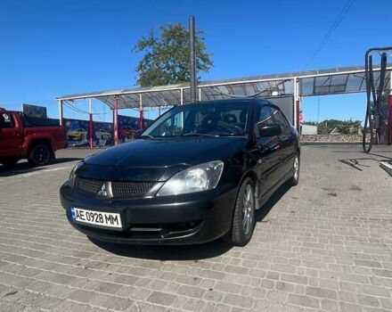 Чорний Міцубісі Lancer, об'ємом двигуна 2 л та пробігом 181 тис. км за 6000 $, фото 1 на Automoto.ua