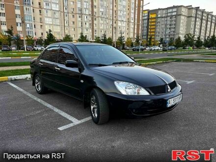 Чорний Міцубісі Lancer, об'ємом двигуна 1.6 л та пробігом 329 тис. км за 3500 $, фото 1 на Automoto.ua