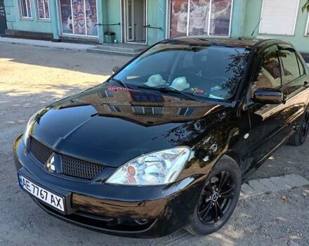 Черный Мицубиси Лансер, объемом двигателя 1.6 л и пробегом 240 тыс. км за 5400 $, фото 1 на Automoto.ua