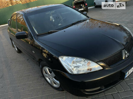 Чорний Міцубісі Lancer, об'ємом двигуна 1.58 л та пробігом 256 тис. км за 5350 $, фото 1 на Automoto.ua