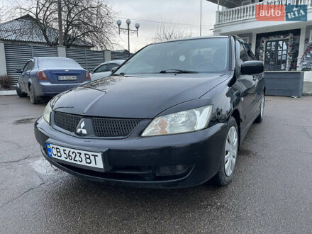 Чорний Міцубісі Lancer, об'ємом двигуна 1.58 л та пробігом 196 тис. км за 3800 $, фото 1 на Automoto.ua