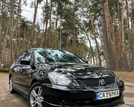 Черный Мицубиси Лансер, объемом двигателя 2 л и пробегом 243 тыс. км за 5400 $, фото 1 на Automoto.ua