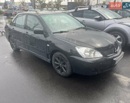 Чорний Міцубісі Lancer, об'ємом двигуна 1.58 л та пробігом 257 тис. км за 2400 $, фото 1 на Automoto.ua