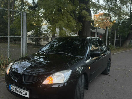 Черный Мицубиси Лансер, объемом двигателя 1.6 л и пробегом 233 тыс. км за 3650 $, фото 1 на Automoto.ua