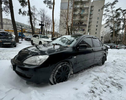 Черный Мицубиси Лансер, объемом двигателя 1.6 л и пробегом 250 тыс. км за 3000 $, фото 1 на Automoto.ua