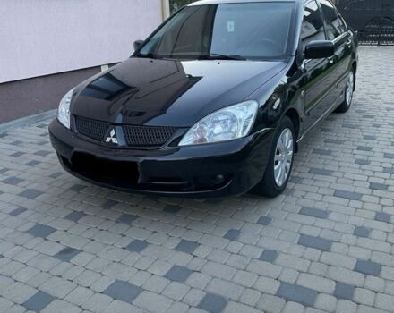 Черный Мицубиси Лансер, объемом двигателя 1.6 л и пробегом 178 тыс. км за 4800 $, фото 1 на Automoto.ua