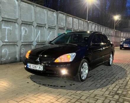 Черный Мицубиси Лансер, объемом двигателя 1.59 л и пробегом 202 тыс. км за 5000 $, фото 1 на Automoto.ua