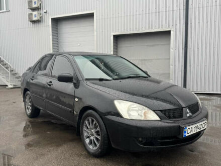 Черный Мицубиси Лансер, объемом двигателя 1.6 л и пробегом 368 тыс. км за 3200 $, фото 1 на Automoto.ua