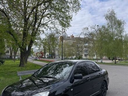 Чорний Міцубісі Lancer, об'ємом двигуна 1.58 л та пробігом 293 тис. км за 4200 $, фото 1 на Automoto.ua