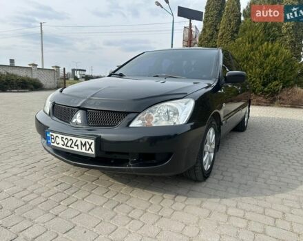 Черный Мицубиси Лансер, объемом двигателя 1.58 л и пробегом 245 тыс. км за 3550 $, фото 1 на Automoto.ua