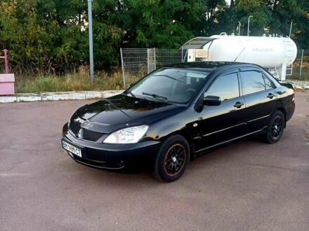 Чорний Міцубісі Lancer, об'ємом двигуна 1.58 л та пробігом 197 тис. км за 5000 $, фото 1 на Automoto.ua