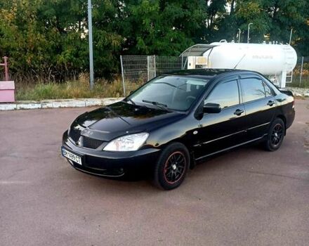 Чорний Міцубісі Lancer, об'ємом двигуна 1.58 л та пробігом 197 тис. км за 5000 $, фото 1 на Automoto.ua