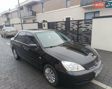 Черный Мицубиси Лансер, объемом двигателя 1.6 л и пробегом 187 тыс. км за 3600 $, фото 1 на Automoto.ua