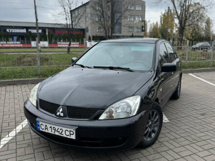 Черный Мицубиси Лансер, объемом двигателя 1.58 л и пробегом 370 тыс. км за 3500 $, фото 1 на Automoto.ua
