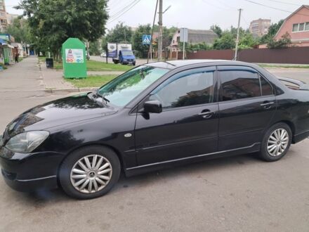 Чорний Міцубісі Lancer, об'ємом двигуна 2 л та пробігом 239 тис. км за 4800 $, фото 1 на Automoto.ua