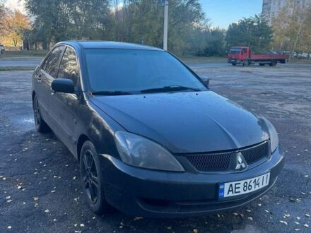 Черный Мицубиси Лансер, объемом двигателя 2 л и пробегом 200 тыс. км за 2999 $, фото 1 на Automoto.ua