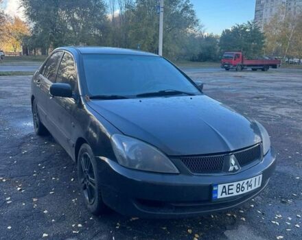 Черный Мицубиси Лансер, объемом двигателя 2 л и пробегом 200 тыс. км за 2999 $, фото 1 на Automoto.ua