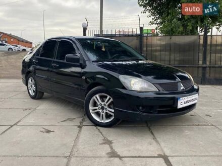 Чорний Міцубісі Lancer, об'ємом двигуна 2 л та пробігом 248 тис. км за 4990 $, фото 1 на Automoto.ua