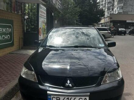 Чорний Міцубісі Lancer, об'ємом двигуна 1.58 л та пробігом 190 тис. км за 4750 $, фото 1 на Automoto.ua