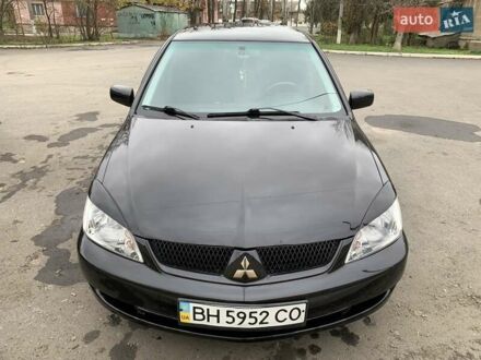 Черный Мицубиси Лансер, объемом двигателя 1.6 л и пробегом 164 тыс. км за 5200 $, фото 1 на Automoto.ua