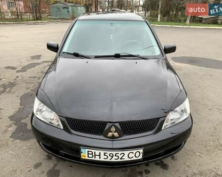 Черный Мицубиси Лансер, объемом двигателя 1.6 л и пробегом 164 тыс. км за 5200 $, фото 1 на Automoto.ua