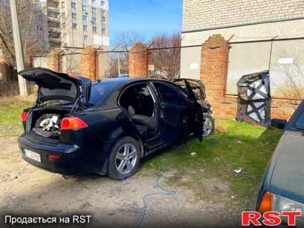 Чорний Міцубісі Lancer, об'ємом двигуна 2 л та пробігом 1 тис. км за 1500 $, фото 1 на Automoto.ua