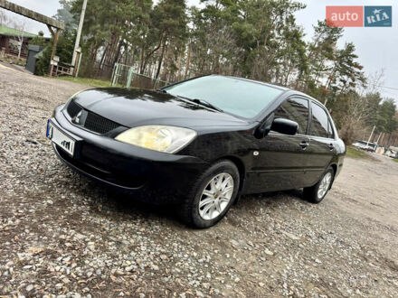 Черный Мицубиси Лансер, объемом двигателя 1.6 л и пробегом 216 тыс. км за 4990 $, фото 1 на Automoto.ua