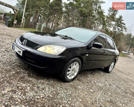 Черный Мицубиси Лансер, объемом двигателя 1.6 л и пробегом 216 тыс. км за 4990 $, фото 1 на Automoto.ua