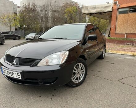 Черный Мицубиси Лансер, объемом двигателя 1.6 л и пробегом 173 тыс. км за 4700 $, фото 1 на Automoto.ua