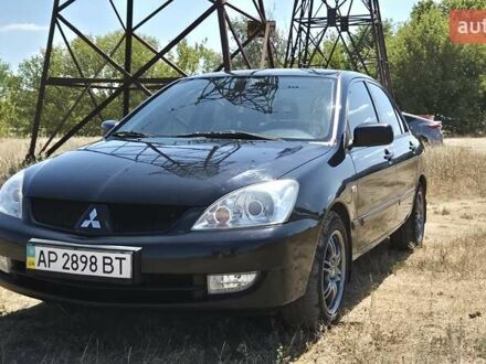 Мицубиси Лансер 2007 в Запорожье на Automoto.ua Черный Мицубиси Лансер, объемом двигателя 1.58 л и пробегом 219 тыс. км за 5800 $, фото 1 на Automoto.ua