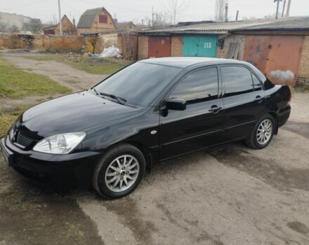 Черный Мицубиси Лансер, объемом двигателя 1.6 л и пробегом 187 тыс. км за 6200 $, фото 1 на Automoto.ua