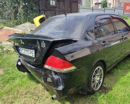 Черный Мицубиси Лансер, объемом двигателя 1.6 л и пробегом 22 тыс. км за 1700 $, фото 1 на Automoto.ua