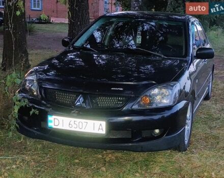 Чорний Міцубісі Lancer, об'ємом двигуна 2 л та пробігом 267 тис. км за 4800 $, фото 1 на Automoto.ua