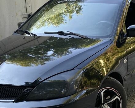 Чорний Міцубісі Lancer, об'ємом двигуна 1.6 л та пробігом 234 тис. км за 4000 $, фото 1 на Automoto.ua