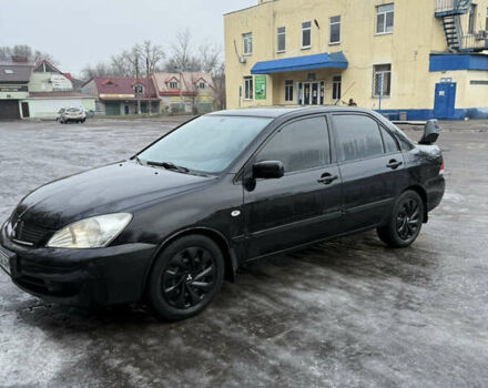 Черный Мицубиси Лансер, объемом двигателя 1.6 л и пробегом 112 тыс. км за 4700 $, фото 1 на Automoto.ua