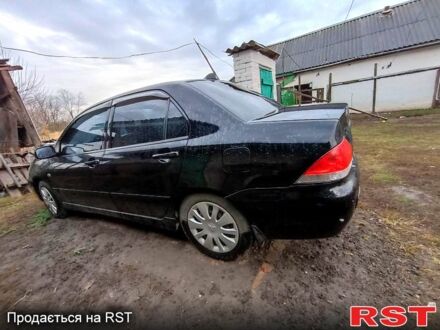 Чорний Міцубісі Lancer, об'ємом двигуна 1.6 л та пробігом 1 тис. км за 3800 $, фото 1 на Automoto.ua