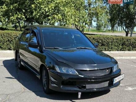 Чорний Міцубісі Lancer, об'ємом двигуна 2 л та пробігом 161 тис. км за 4600 $, фото 1 на Automoto.ua