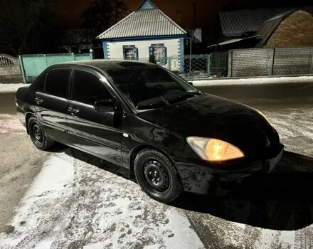 Чорний Міцубісі Lancer, об'ємом двигуна 1.6 л та пробігом 227 тис. км за 3400 $, фото 1 на Automoto.ua