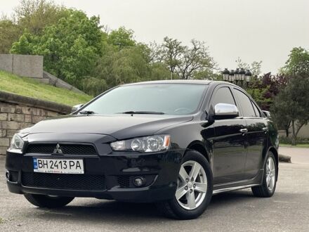 Чорний Міцубісі Lancer, об'ємом двигуна 2 л та пробігом 187 тис. км за 7499 $, фото 1 на Automoto.ua