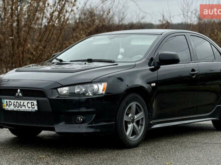 Черный Мицубиси Лансер, объемом двигателя 2 л и пробегом 215 тыс. км за 5500 $, фото 1 на Automoto.ua